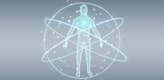 Mensch digital dargestellt, wie im Zentrum eines Atoms