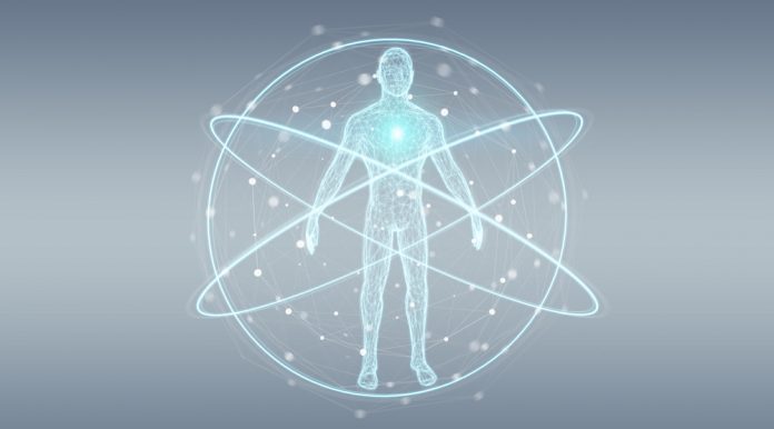 Mensch digital dargestellt, wie im Zentrum eines Atoms